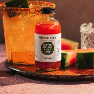 Si Señorita cocktail with a bottle of Wicked Bess shrub