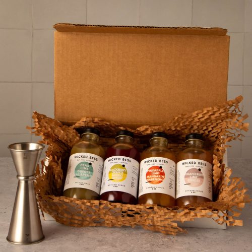 Wicked Bess 4 pack variety bundle — four 4oz artisan shrub bottles, one of each flavor, in a gift box